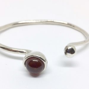 Silver spot bangle with spessartite or kyanite